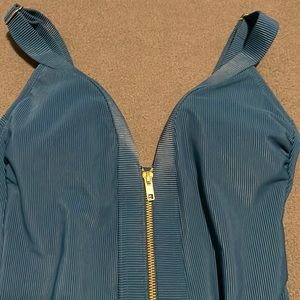 Dark blue with gold zipper